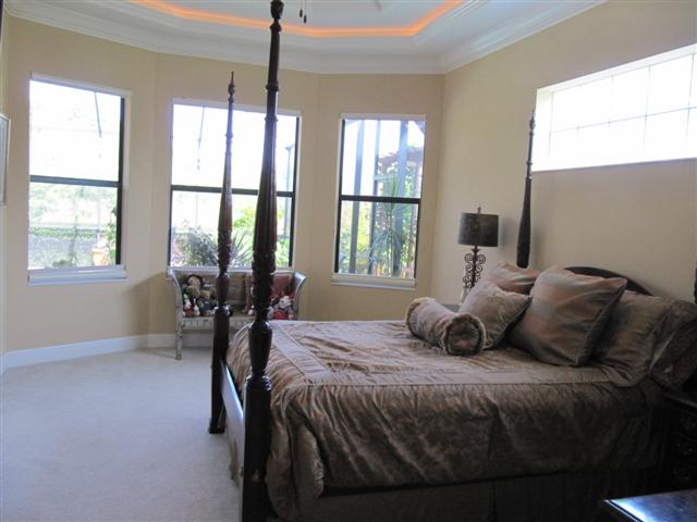 Master Bedroom with views of Pool and Lake