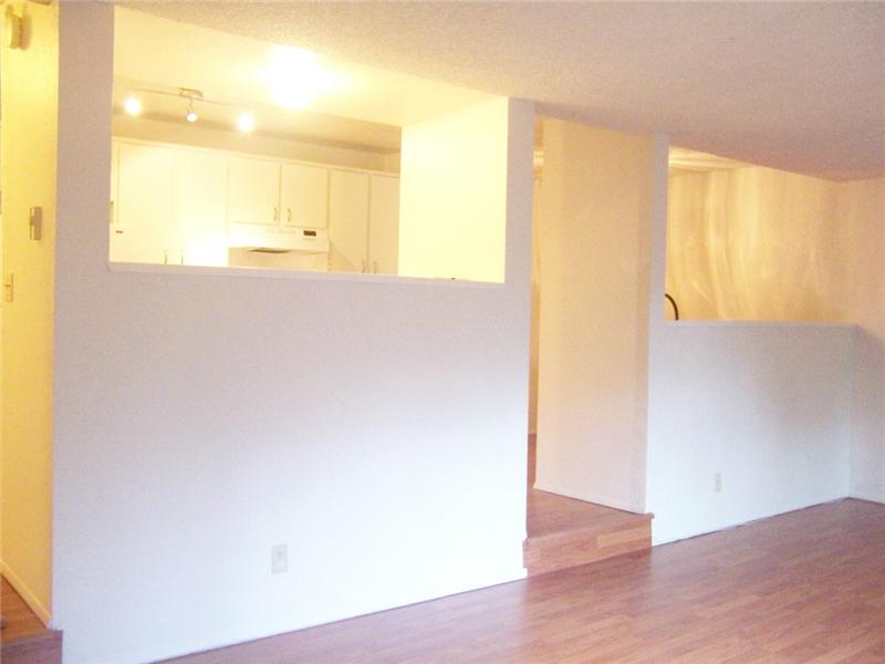 Kitchen and dining overlook sunken living room