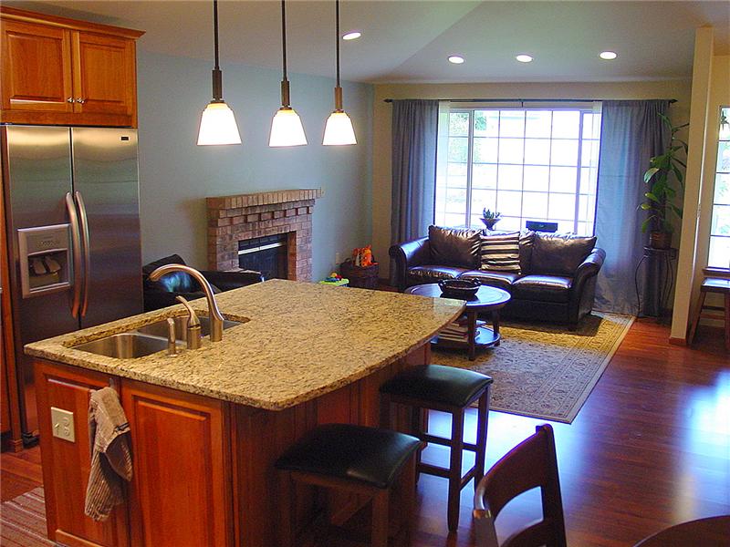 Open concept for living/dining/kitchen of this Ames Lake community home.