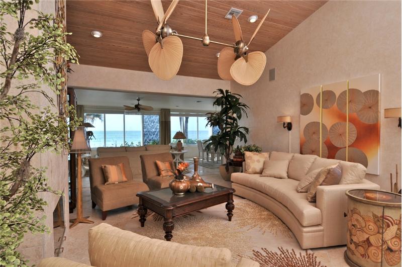 Living Room with Marble Floors & Wood Ceilings