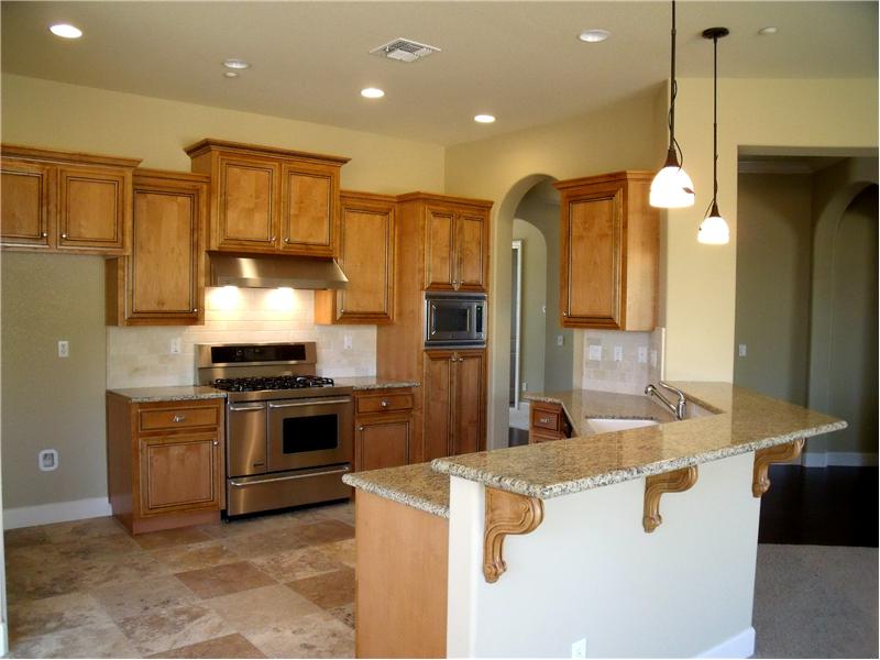 Kitchen features granite counters, stainless appliances