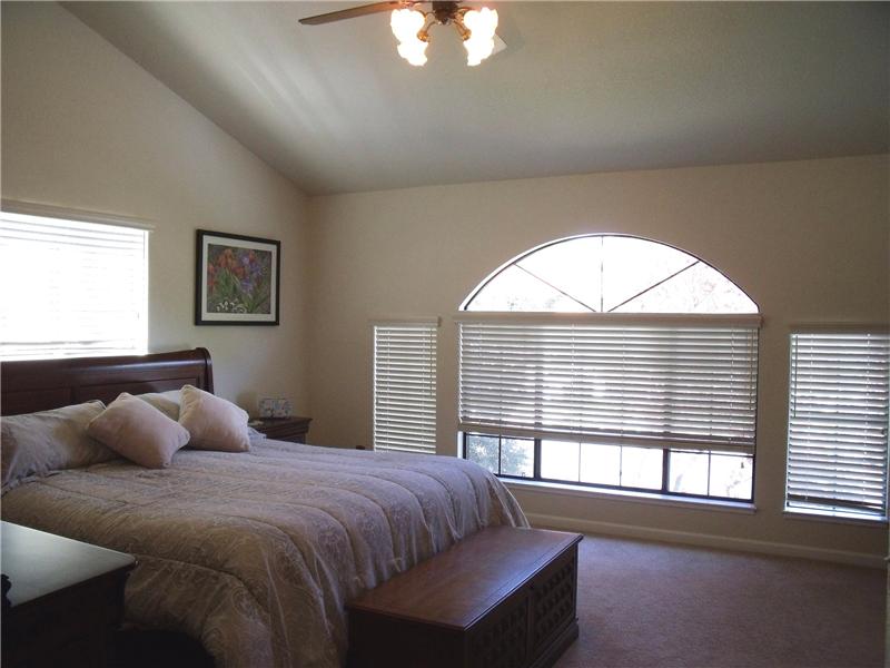 Master bedroom w/2 closets & vaulted ceilings