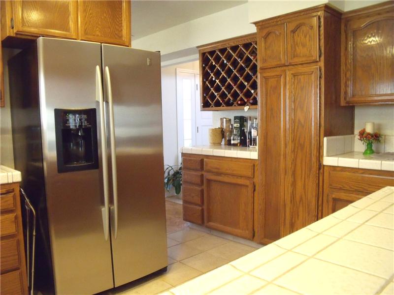 Kitchen features tile floors & counters