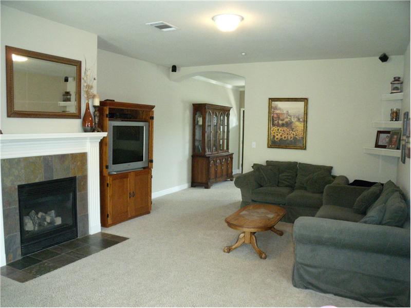 Family room has gas fireplace, wired for surround sound