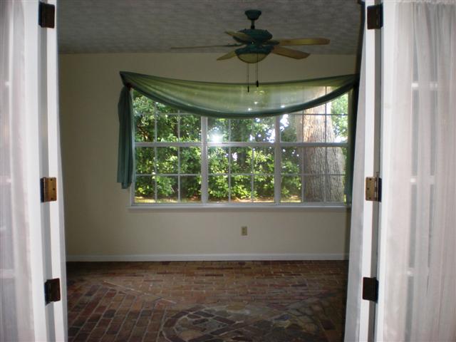Florida room with brick floor