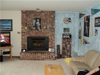 brick fireplace in family room