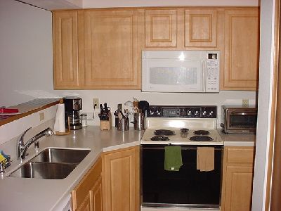 Kitchen is open and bright.