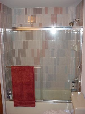Tiled bath with stain, mildew and crack resistant grout.