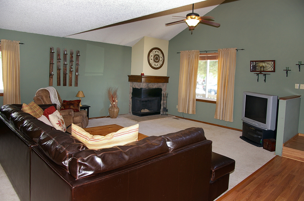 Spacious living room with vaulted ceilings and fireplace
