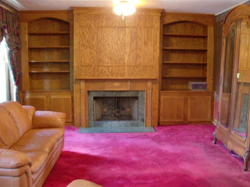 Built in bookcases and fireplace in family room