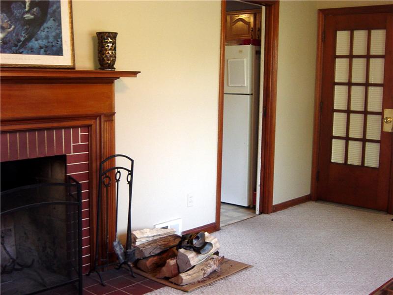 Fireplace and Kitchen View From Entry