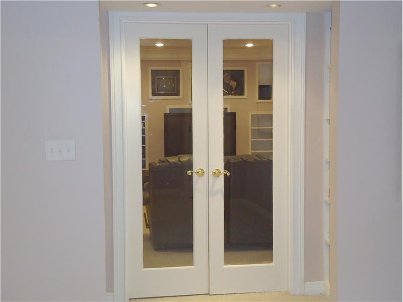 French glass doors entrance to theater room