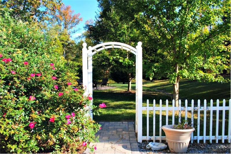 Step through the arch into the private backyard getaway.