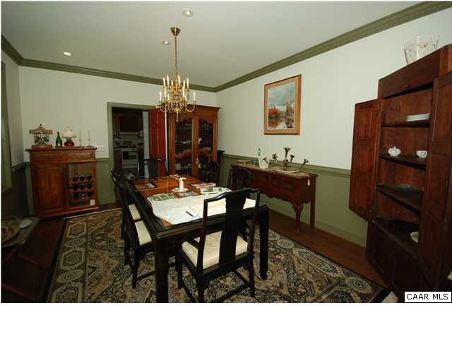 Formal dining room w/ wainscotting and crown molding