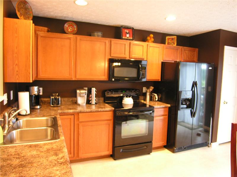 Vinyl floor, wood cabinets, eat-in