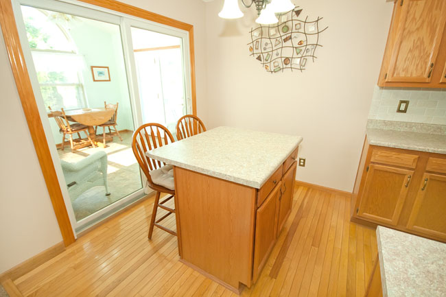 Kitchen with walkout, island, wood floor/cabinets, eat-in