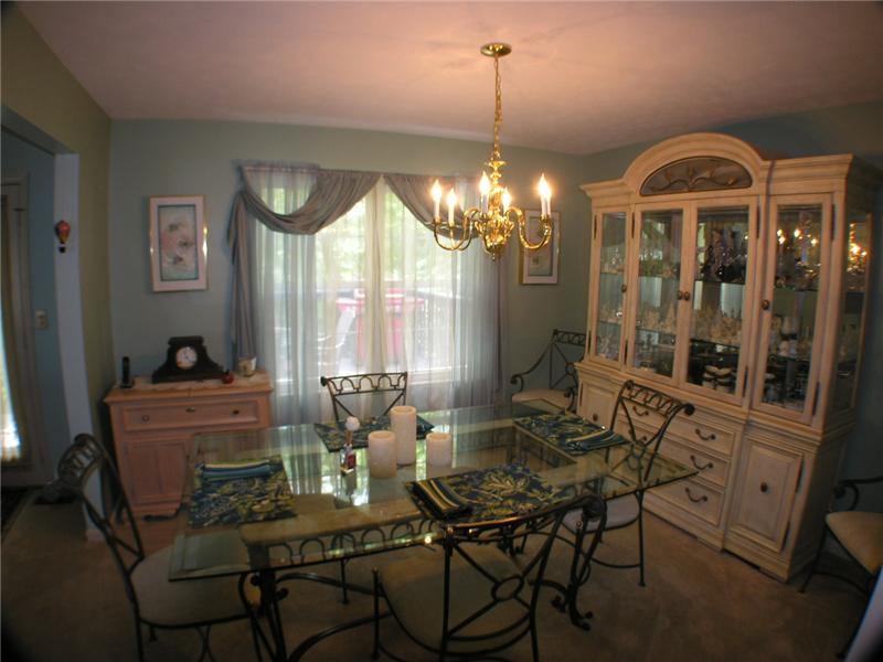 Stunning Dining room includes WW carpet and chandelier