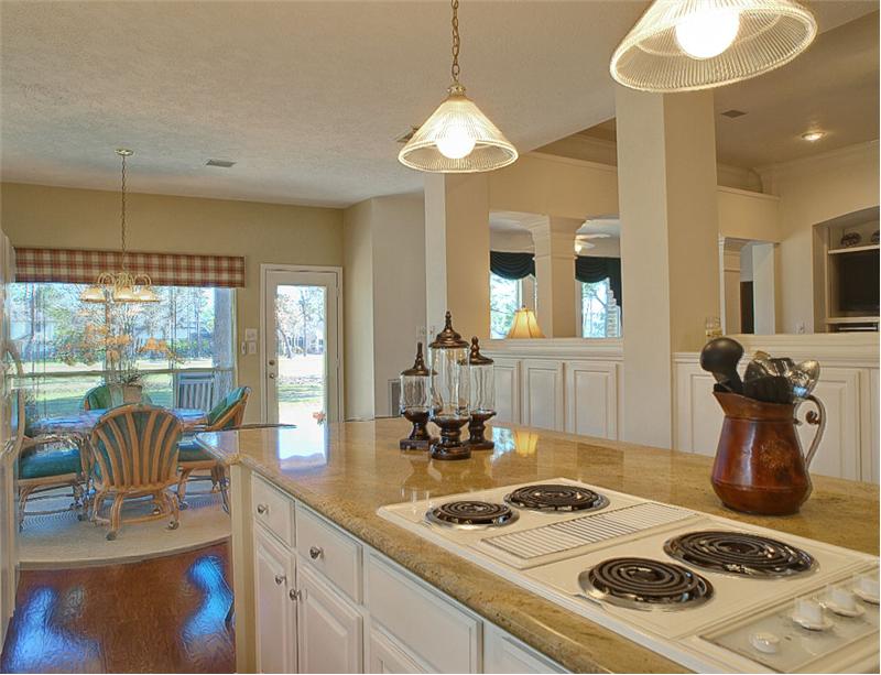 The Gourmet Kitchen features an island cooktop.