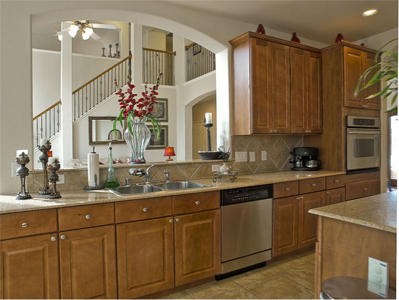 The kitchen is open to the den - the floor plan is terrific!