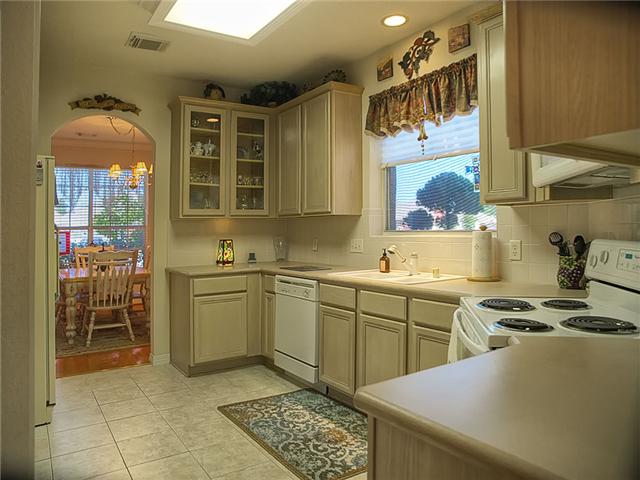 One of the kitchen cabinets is a glass-front.