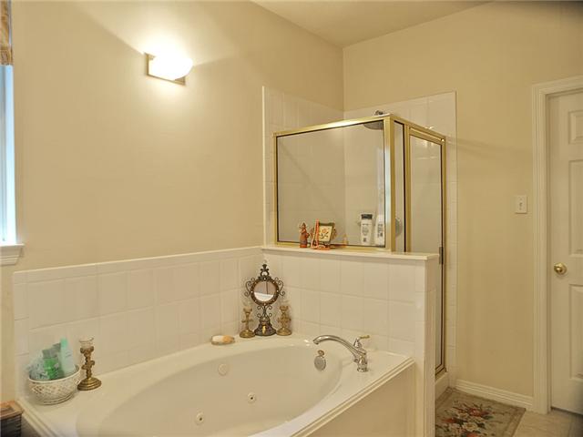 The master bath has separate shower & jet tub.