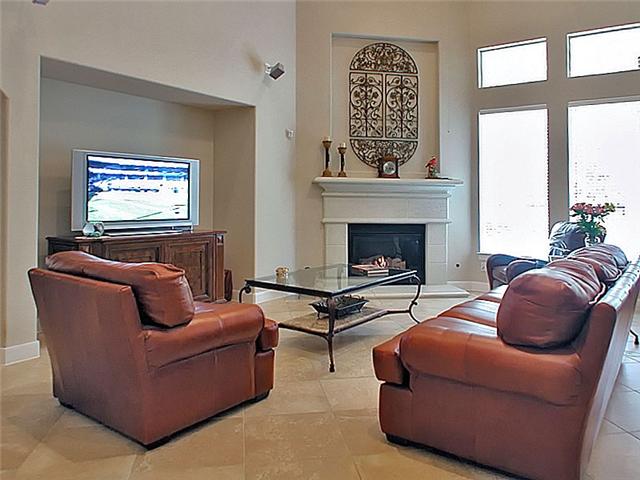 Large den with fireplace & cut out for media placement.