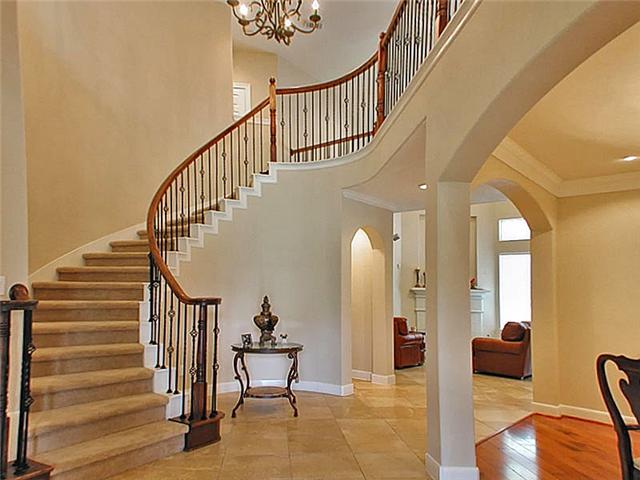 Grand entry with a winding staircase!