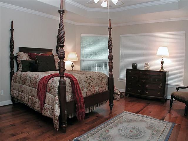 The master bedroomsuite with wood floors & trey ceiling.
