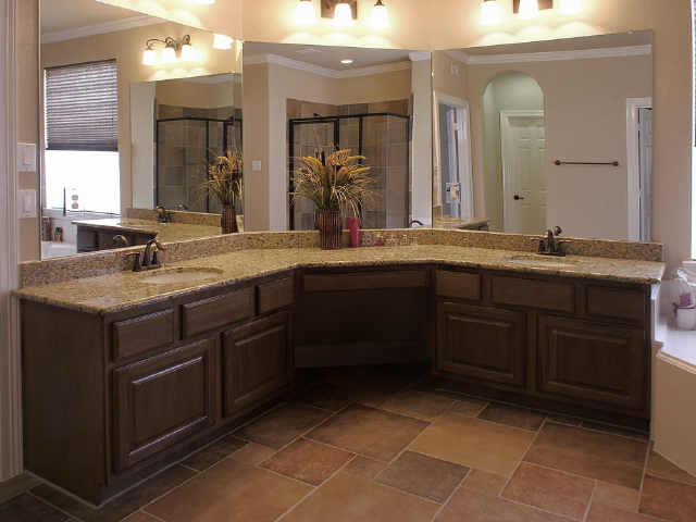 The Master Bath with double sinks & rich cabinets.