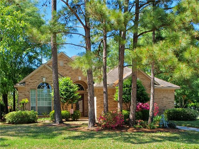 Beautiful trees & manicured landscaping creates inviting curb appeal.