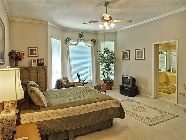 The Master Bedroom has a bay window for its sitting area.