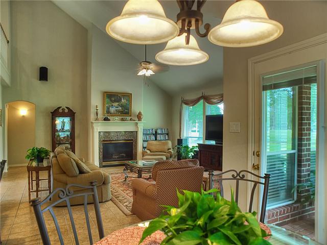 A view of the den & its fireplace from the breakfast room.