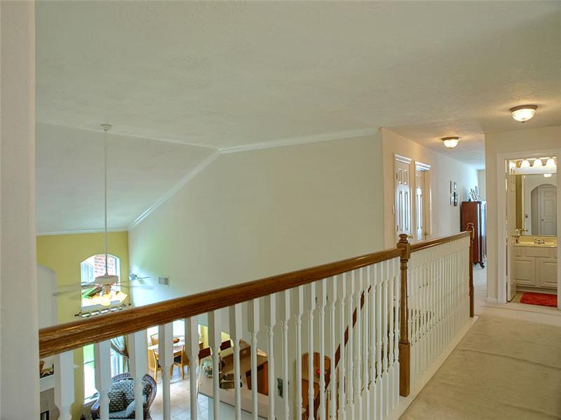 The balcony walkway separates the bedrooms & game room.