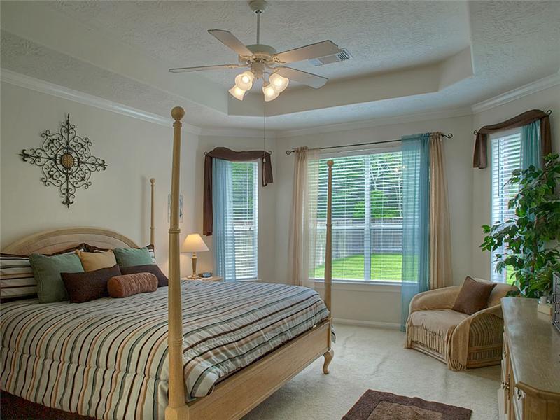 The Master bedroom features a trey ceiling & spaciousness.