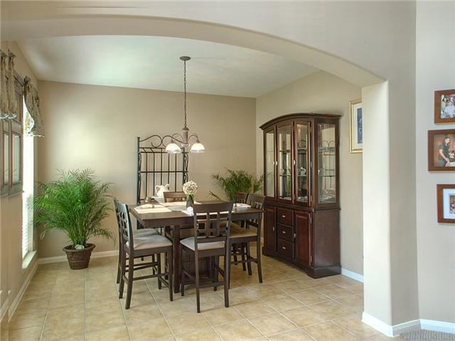 Formal dining room through arch.