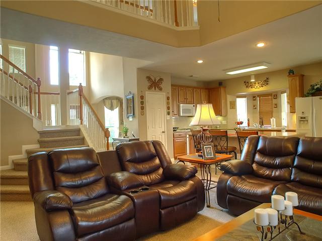 The open floorplan shows the den, kitchen & stairs to second floor.
