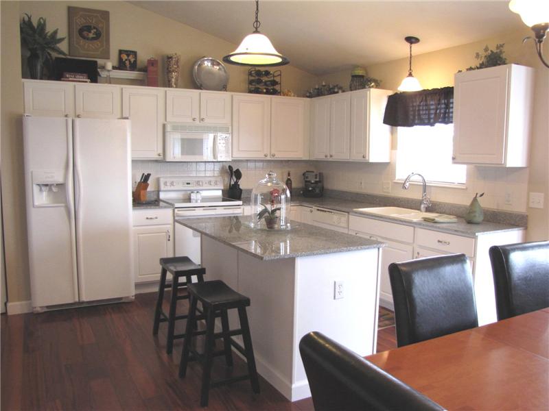 Gourmet Kitchen with Granite Counters an Tile Backsplash