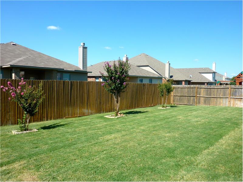 Enjoy a BBQ with friends in the fenced backyard!