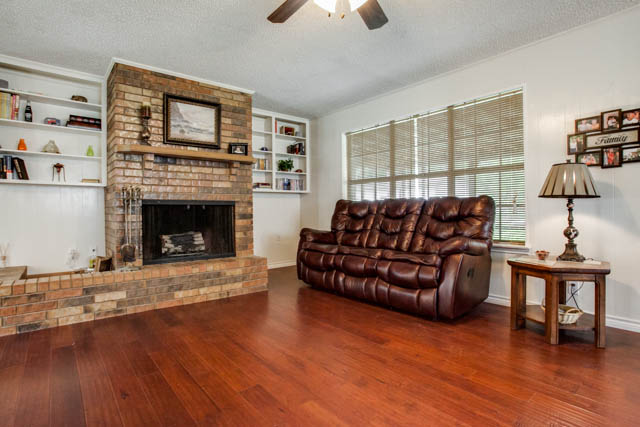 The wood burning brick fireplace will certainly catch your eye.