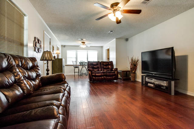 Notice the beautiful hard wood flooring in the living room.