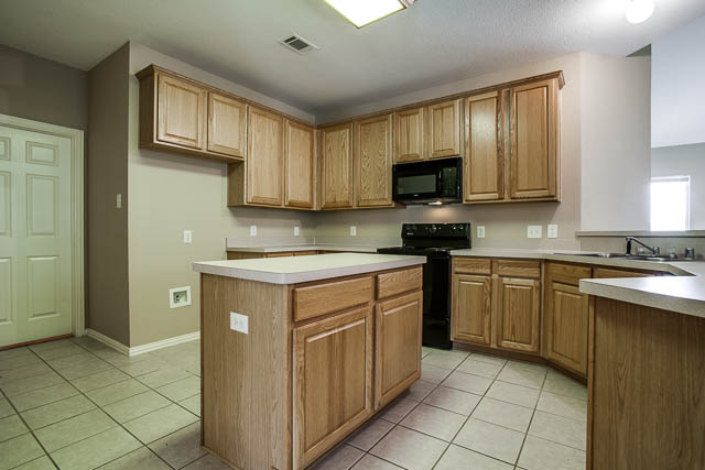 You will find plenty of counter space and cabinet space in the kitchen.