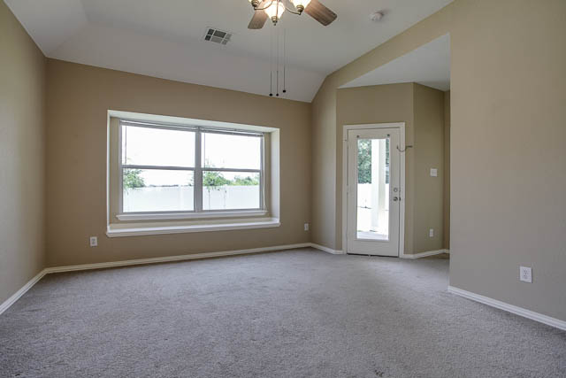 The large master bedroom is located downstairs.
