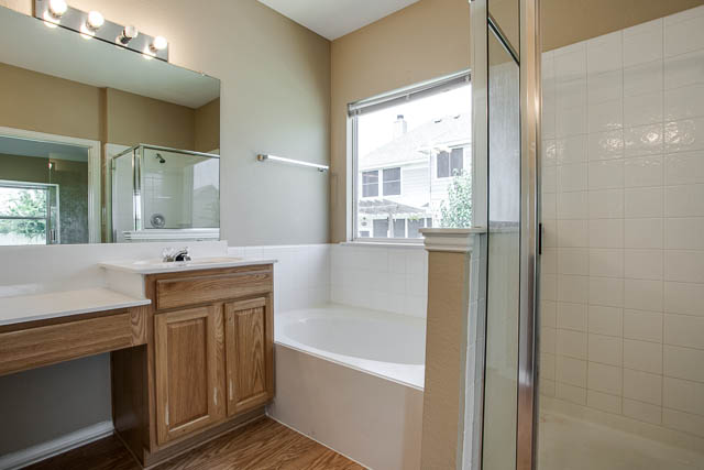 Relax after a long day in the garden tub in the master bathroom.