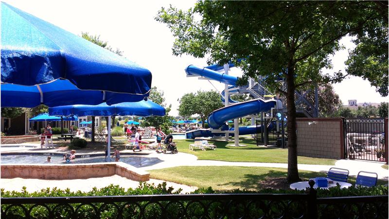 Cool off at the community pool with slides!