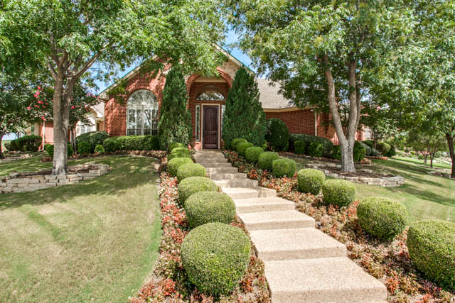 You will love this landscaped corner lot with gorgeous curb appeal.