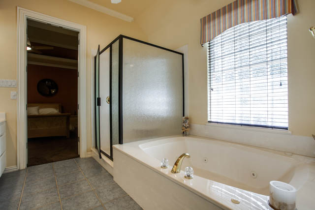 A jetted tub in the master bathroom is the perfect place to relax!