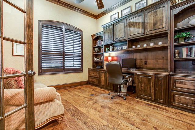 Retreat to a private office with custom built-ins.