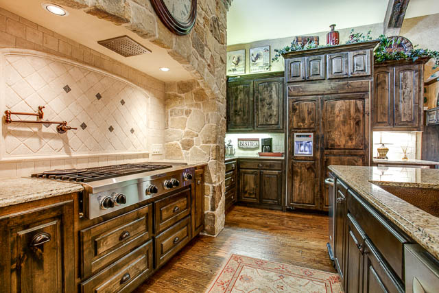 The gourmet kitchen features commercial grade Kitchen Aid appliances.