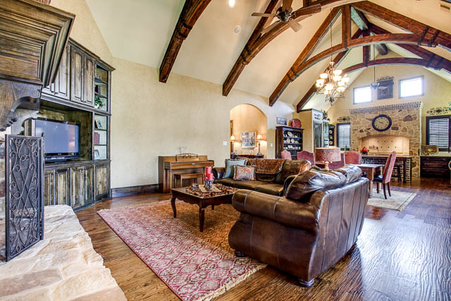 Fall in love with the custom stained grade doors, stonework, fireplace, trim and built ins.