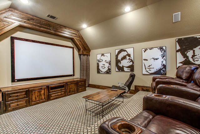 Pop some popcorn and entertain family and friends in the fantastic media room.
